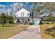 Charming two-story home with a welcoming front porch and a well-manicured lawn at 960 Mooring Dr, Charleston, SC 29412