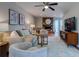 Inviting living room features a brick fireplace, ceiling fan, and comfortable seating, perfect for relaxation at 960 Mooring Dr, Charleston, SC 29412