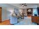 Spacious living room with a fireplace, hardwood floors, comfortable seating, and stylish decor at 960 Mooring Dr, Charleston, SC 29412