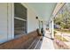 Covered front porch with a wooden bench and a view of the street at 960 Mooring Dr, Charleston, SC 29412