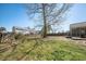 Expansive backyard features a mature tree, lawn, and wooden fence, perfect for outdoor activities and privacy at 103 Old Tree Rd, Goose Creek, SC 29445