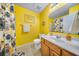 Full bathroom with shower/tub combination, wooden vanity, and warm yellow walls at 103 Old Tree Rd, Goose Creek, SC 29445