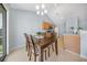 Cozy dining area with hardwood floors, bright light, and access to the patio, creating a comfortable ambiance at 103 Old Tree Rd, Goose Creek, SC 29445
