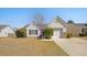 Charming single-story home with white siding, attached garage, and well-manicured front yard at 103 Old Tree Rd, Goose Creek, SC 29445
