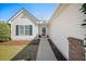 Inviting front entrance with well-maintained landscaping, white siding, and a welcoming walkway at 103 Old Tree Rd, Goose Creek, SC 29445