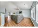 Comfortable living room features hardwood floors, neutral walls, vaulted ceilings, and an abundance of natural light at 103 Old Tree Rd, Goose Creek, SC 29445