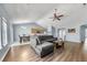 Open-concept living and dining area featuring vaulted ceilings and hardwood floors, creating a warm, inviting space at 103 Old Tree Rd, Goose Creek, SC 29445