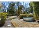 Large backyard featuring a stock tank pool and mature trees at 103 Tall Oak Ave, Charleston, SC 29407