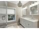 Charming bathroom featuring a double vanity, chandelier, and subway tile shower at 103 Tall Oak Ave, Charleston, SC 29407