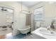 Inviting bathroom featuring claw foot bathtub and vintage fixtures at 103 Tall Oak Ave, Charleston, SC 29407