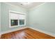 Cozy bedroom with wooden floors, large windows and natural lighting at 103 Tall Oak Ave, Charleston, SC 29407