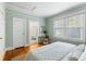 Airy bedroom showing natural lighting, hard wood floors, with an attached bathroom at 103 Tall Oak Ave, Charleston, SC 29407