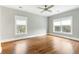 A bright, empty bedroom with hardwood floors, and plenty of light at 103 Tall Oak Ave, Charleston, SC 29407