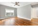 Empty bedroom featuring hardwood floors and a window, with an ensuite bathroom at 103 Tall Oak Ave, Charleston, SC 29407