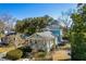 Charming home with a well-maintained lawn and mature trees, providing a serene outdoor space at 103 Tall Oak Ave, Charleston, SC 29407