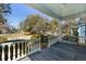 Inviting front porch with a hanging swing and a view of the neighborhood at 103 Tall Oak Ave, Charleston, SC 29407