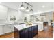 Modern kitchen featuring white cabinetry, stainless steel appliances, and a center island at 103 Tall Oak Ave, Charleston, SC 29407