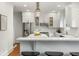 Modern kitchen featuring white cabinetry, stainless steel appliances, and a center island at 103 Tall Oak Ave, Charleston, SC 29407