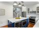 Bright kitchen featuring a large island with marble countertop, wine cooler and stainless steel appliances at 103 Tall Oak Ave, Charleston, SC 29407