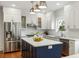 Modern kitchen featuring white cabinetry, stainless steel appliances, and a center island at 103 Tall Oak Ave, Charleston, SC 29407