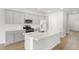 Bright kitchen features an island, stainless steel appliances, and ample gray cabinetry at 1041 Swamp Rose Run, Summerville, SC 29485