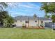 Backyard featuring a wooden deck with outdoor seating, lush lawn, and privacy fencing, ideal for relaxation and entertainment at 105 Chadwick Dr, Charleston, SC 29407