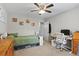 Well-lit bedroom featuring a ceiling fan, a twin bed and a desk at 105 Gatewood St, North Charleston, SC 29418