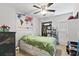 Bright bedroom with a world map tapestry, ceiling fan, and closet at 105 Gatewood St, North Charleston, SC 29418