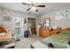 Cozy bedroom with a desk, chair, floral wallpaper and a green bedspread at 105 Gatewood St, North Charleston, SC 29418