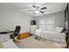 Bedroom featuring a ceiling fan, a bed with white bedding and a dark-colored office chair at 105 Gatewood St, North Charleston, SC 29418