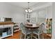 Charming dining area featuring a wood table set near windows, with overhead lighting at 105 Gatewood St, North Charleston, SC 29418