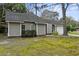 A single-story home with a well-manicured lawn, showcasing its pleasant curb appeal at 105 Gatewood St, North Charleston, SC 29418