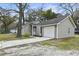 Exterior view of the home featuring a garage and neatly kept lawn at 105 Gatewood St, North Charleston, SC 29418