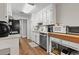 Functional kitchen featuring stainless steel appliances, white cabinetry, and wood flooring at 105 Gatewood St, North Charleston, SC 29418