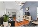 Well-lit living room showcasing wood floors, a ceiling fan, and comfortable seating at 105 Gatewood St, North Charleston, SC 29418