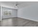 Spacious bedroom featuring neutral walls, modern gray flooring, and a large window at 106 Equestrian Ct, Summerville, SC 29486