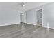 Spacious bedroom with easy access to the bathroom with neutral walls, modern gray flooring, and a ceiling fan at 106 Equestrian Ct, Summerville, SC 29486