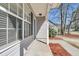 Inviting front porch of a cozy home, featuring classic columns and manicured landscaping at 106 Equestrian Ct, Summerville, SC 29486