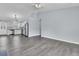Open-concept design connects the spacious living area with modern gray floors to a bright kitchen at 106 Equestrian Ct, Summerville, SC 29486