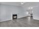 Bright living room with a fireplace, high ceiling, and modern gray flooring at 106 Equestrian Ct, Summerville, SC 29486