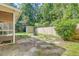 Home's backyard featuring mature trees, a wood fence, a shed, and a small patio at 112 Blue Heron Dr, Summerville, SC 29485