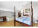 Bright bedroom with vaulted ceilings, a four-poster bed, and hardwood floors at 112 Blue Heron Dr, Summerville, SC 29485