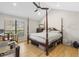 Spacious bedroom with vaulted ceilings, hardwood floors and a four-poster bed at 112 Blue Heron Dr, Summerville, SC 29485