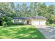 Charming single-story home with a well-manicured lawn and two-car garage at 112 Blue Heron Dr, Summerville, SC 29485