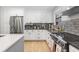 Well-equipped kitchen with stainless steel refrigerator and gray subway tile backsplash at 112 Blue Heron Dr, Summerville, SC 29485