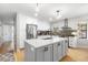 Open kitchen with a center island, stainless steel appliances, and modern finishes at 112 Blue Heron Dr, Summerville, SC 29485