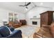Comfortable living room with vaulted ceiling, fireplace, piano, and hardwood floors at 112 Blue Heron Dr, Summerville, SC 29485