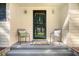 Inviting front porch with seating and a welcoming 'hello' mat at 112 Blue Heron Dr, Summerville, SC 29485