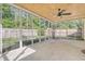 Home's screened porch with a ceiling fan and views of the backyard at 112 Blue Heron Dr, Summerville, SC 29485