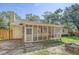 Home's screened porch with a ceiling fan and views of the wooded backyard at 112 Blue Heron Dr, Summerville, SC 29485